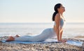 Beach, yoga and woman doing a stretching exercise for mind, body and spiritual wellness and health. Calm, zen and girl Royalty Free Stock Photo