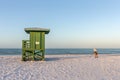 Beachcomber and Lifeguard Station on an Early Morning Beach Royalty Free Stock Photo