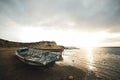 Beached boat and the sunrise Royalty Free Stock Photo