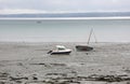 Beached boats on the muddy sand at low tide in europe