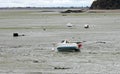 beached boats stranded on sand at low tide
