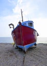 Fishing boat beached on shingle Royalty Free Stock Photo
