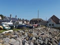 Beached Inshore Fishing Boats stacked at the Harbours edge amongst the old Fishermens Cottages of Gourdon