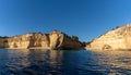 The beaches and cliifs of the Algarve Coast in Portugal under bright blue sky