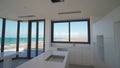 Beachfront penthouse tour, modern design kitchen, panoramic seaside views, high-end real estate showcase