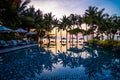 Beachfront sunrise with pool and palm trees in Hua Hin, Prachuap Khiri Khan, Thailand Royalty Free Stock Photo