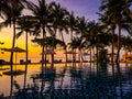 Beachfront sunrise with pool and palm trees in Hua Hin, Prachuap Khiri Khan, Thailand Royalty Free Stock Photo