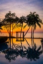 Beachfront sunrise with pool and palm trees in Hua Hin, Prachuap Khiri Khan, Thailand Royalty Free Stock Photo