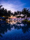 Beachfront sunrise with pool and palm trees in Hua Hin, Prachuap Khiri Khan, Thailand Royalty Free Stock Photo