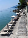 Beachfront with umbrellas and chairs Opatija Croatia