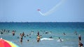 Beachgoers enjoy the Atlantic Ocean and the Fort Lauderdale Air Show