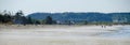 Beachgoers during low tide at Deception Pass state Park