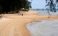 Beachgoers at tropical Kampong Tekek beach Tioman island Malaysia Royalty Free Stock Photo
