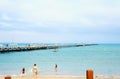 Beachport, Australia - December, 30, 2019: Beachport pier and people enjoying summer on the beach