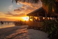 beachside eatery with view of sun setting over the water