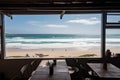 beachside eatery, with view of waves crashing on the beach and seagulls flying overhead Royalty Free Stock Photo