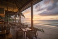 beachside restaurant with a view of the sunset, serving seafood and cocktails