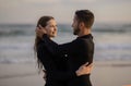 Beachside Romance. Portrait Of Romantic Young Surfers Couple Embracing On The Beach Royalty Free Stock Photo