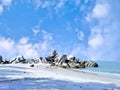 The beachside view is decorated with large rocks that form naturally