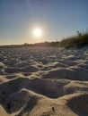 Mid day sun from low angle on beach.