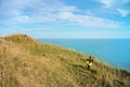 Beachy Head cliff, the highest at Seven Sister country park and graves of suicides who jumped down and blue seascape of English ch