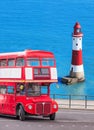 Beachy Head lighthouse with double decker bus in England, Eastbourne, UK