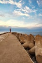 Beacon at the end of a pier in Swinoujscie at sunset, Poland Royalty Free Stock Photo