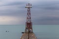 Beacon on pier of Lake Michigan during a storm Royalty Free Stock Photo