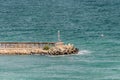 Beacon and seawall. Yacht marina on Black Sea coast Royalty Free Stock Photo