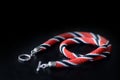 Bead crochet necklace red, black and white colors on a dark background Royalty Free Stock Photo