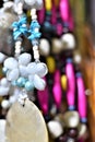 Bead necklace adorned with seashells