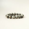 Bead stringing hand bracelet decoration. Hand made gem stone dalmatian jasper fashion accessory.