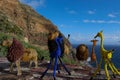 Beaded african artwork or curios placed on a rock wall at Chapmans Peak, Cape Town