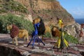 Beaded african artwork or curios placed on a rock wall at Chapmans Peak, Cape Town