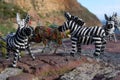 Beaded african artwork or curios placed on a rock wall at Chapmans Peak, Cape Town