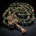 A beaded bracelet that looks like a rosary on a dark background. Ramadan as a time of fasting and prayer for Muslims