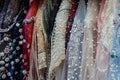 beaded and embellished hijabs on a rack for special occasions Royalty Free Stock Photo