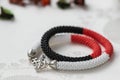 Beaded necklace of white, red and black beads Royalty Free Stock Photo