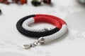 Beaded necklace of white, red and black beads Royalty Free Stock Photo
