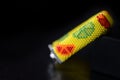 Beaded yellow bracelet with citrus print on a dark background