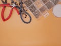 Beading tools flat lay on orange background Royalty Free Stock Photo