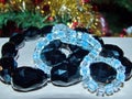 Beads of black agate and bluish moonstone. Jewelry made of black agate is unusual and has a mystical beauty. Royalty Free Stock Photo