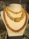 Beads from large white Baltic amber on a jewelry stand