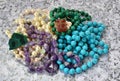 Beads from malachite, amethyst, pearls and turquoise close up.