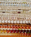 Beads and necklaces made of colored semi-precious stones Royalty Free Stock Photo