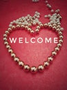 Beads or perls with text on rex ackground,lined a heart