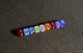 Beads Spelling `improvise` With `E` Replaced By `M` Royalty Free Stock Photo