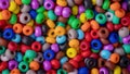 Beads texture background. Colorful round small beads, full frame shot. 16:9 panoramic format