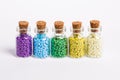 Colorful beads in the bottles Royalty Free Stock Photo