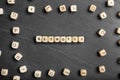 Beads with word KEYWORDS on grey background, flat lay